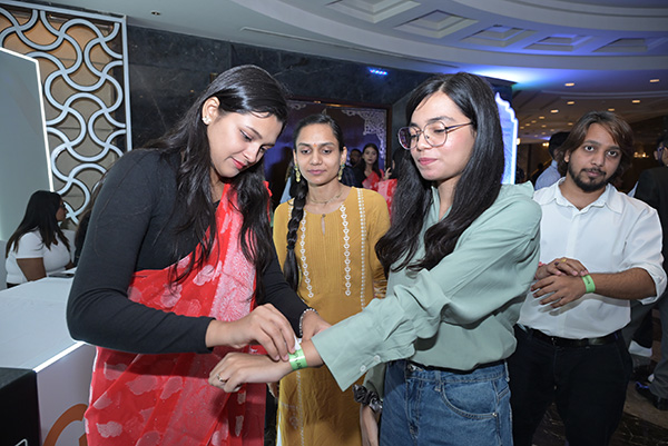 Students visiting an exhibition stand at India Mining Week