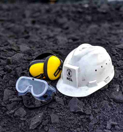 Miner in full safety equipment underground